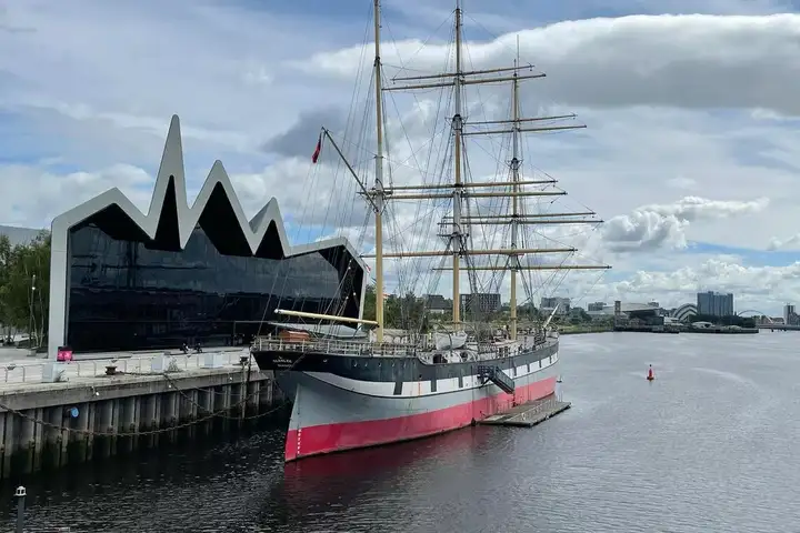 The tall ship Glenlee sits in front of Glasgow's Riverside Museum.